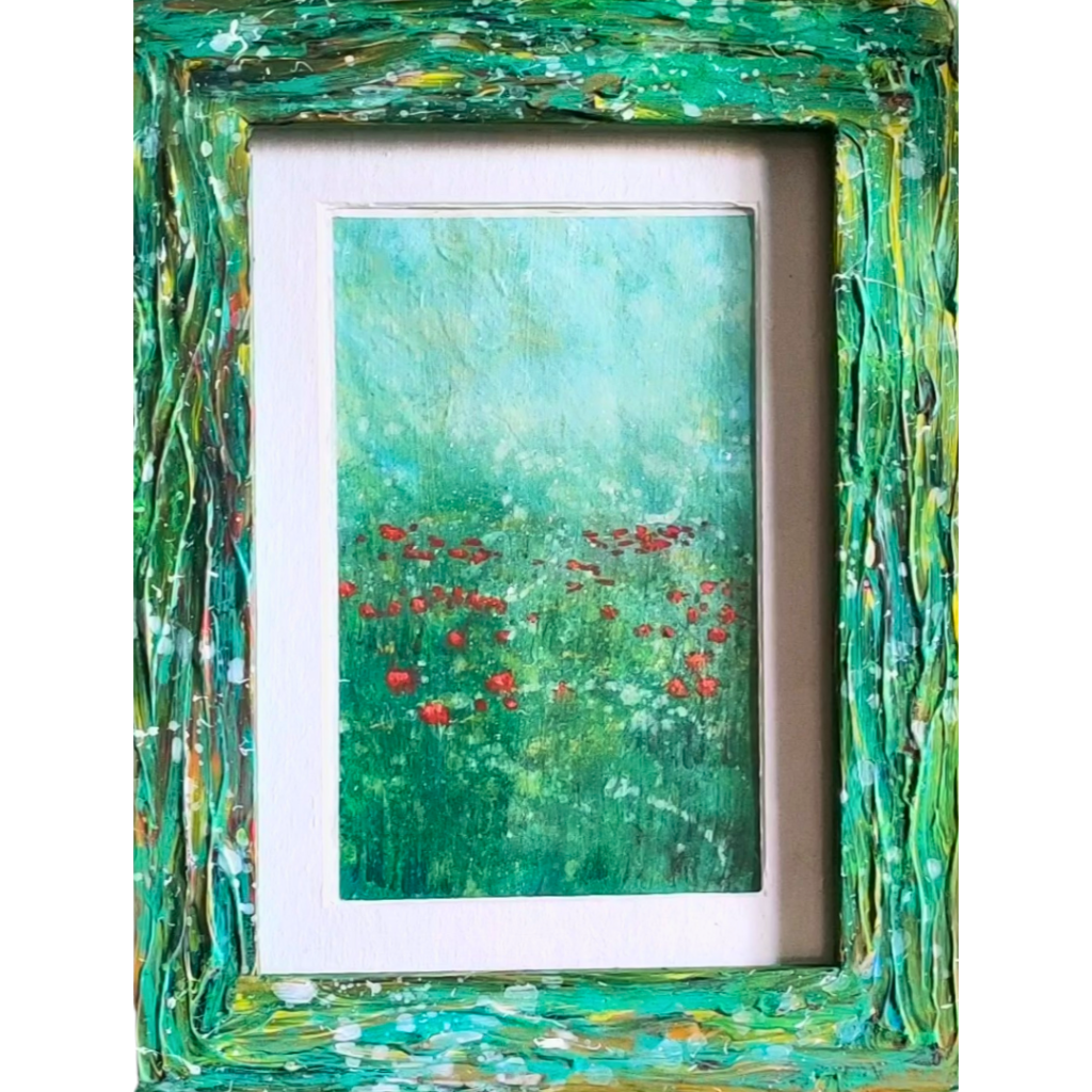 a painting of a field of poppies in a green frame