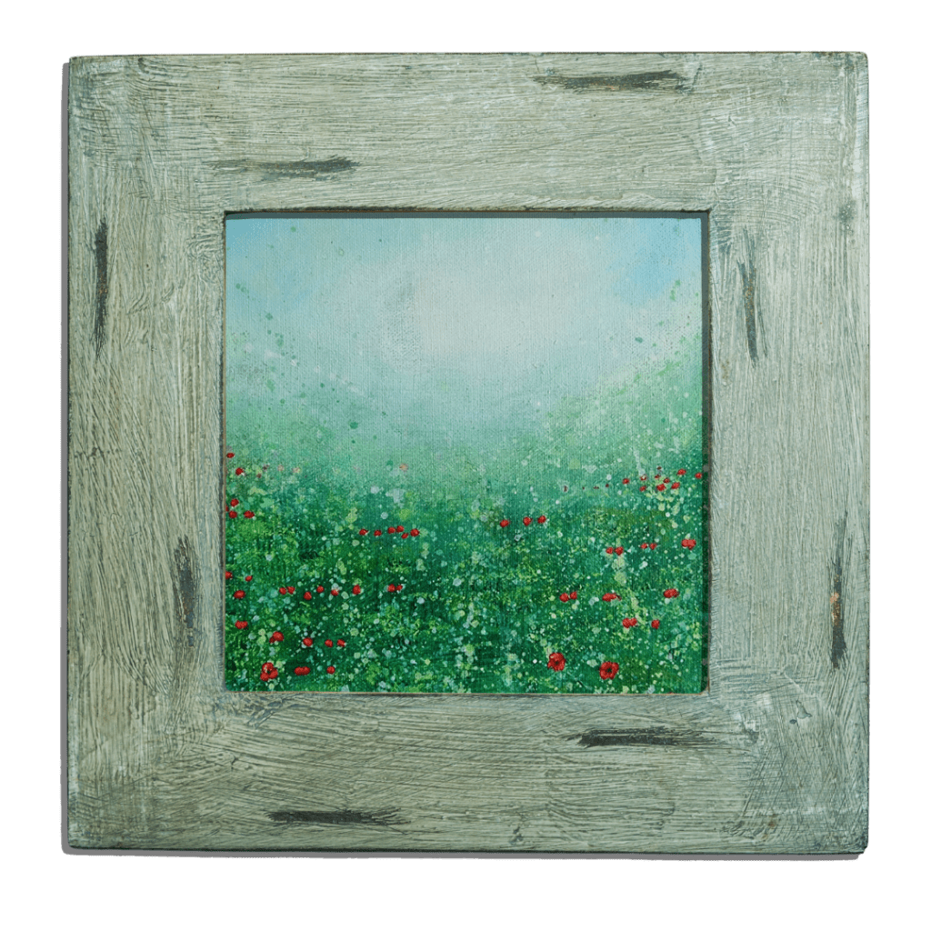a miniature acrylic painting of a field of red poppies in a wooden frame